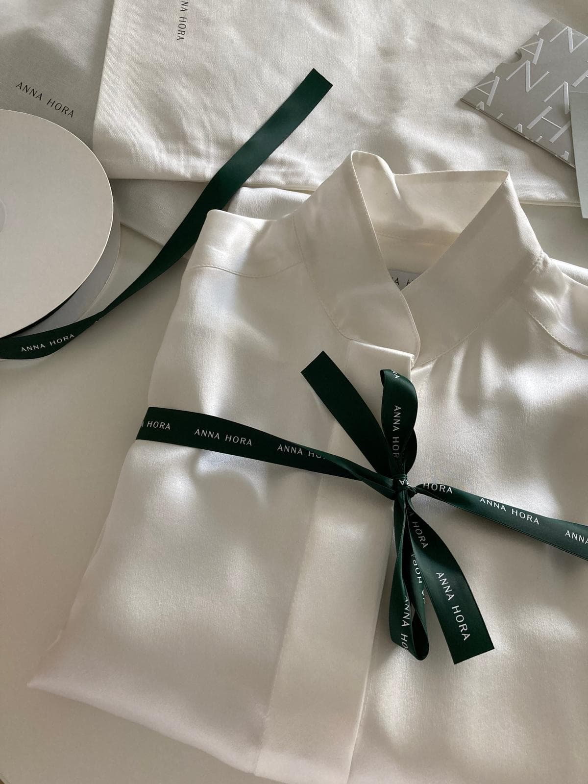 Folded garment tied with ribbon